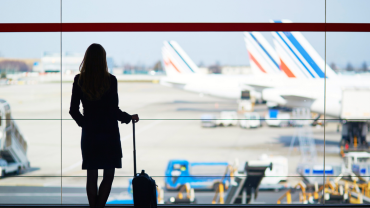 Travelers walking airport for multi-country tour