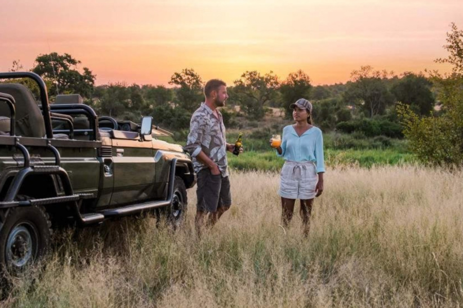 A couple on a sundowner during a kruger safari